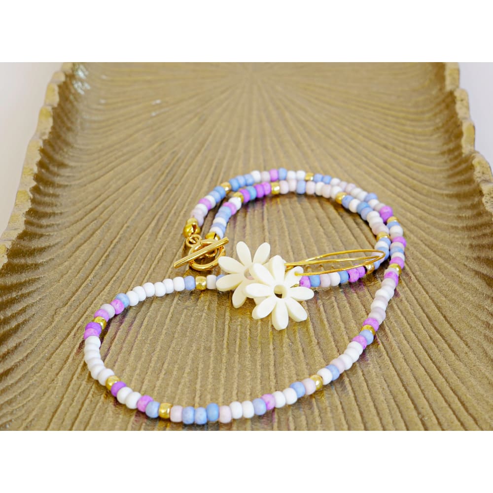 trinity necklace and leopard daisy earrings